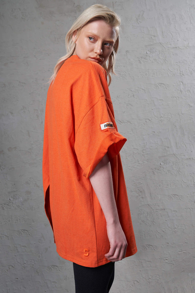 side of a sustainable orange women t-shirt with a crossover backsplit