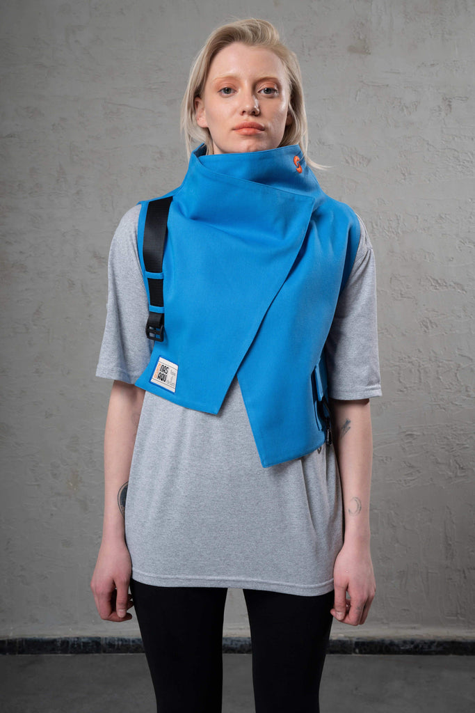 cobalt blue sustainable gender free accessories vest on a grey eco-friendly t-shirt