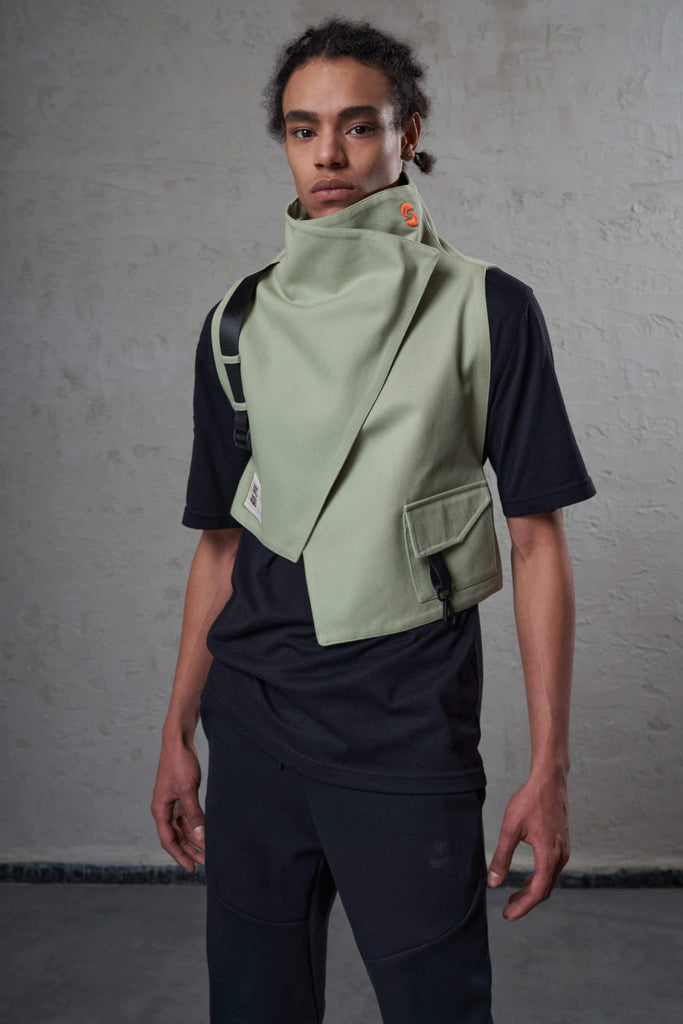 young african brasilian man wearing sustainable fashion vest on a ethical cotton black t-shirt